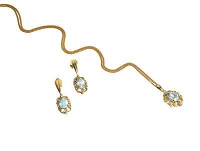 Lot 196 - A 9 Carat Gold Blue Topaz and Diamond Pendant...