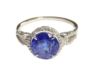 Lot 160 - A Tanzanite and Diamond Ring, the round cut...
