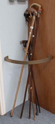 Lot 254 - A Collection of Walking Sticks, including one...
