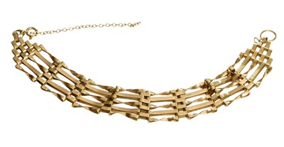 Lot 195 - A Gate Link Bracelet, stamped '375', length 16....