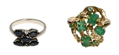 Lot 232 - An Emerald Cluster Ring, set throughout with...