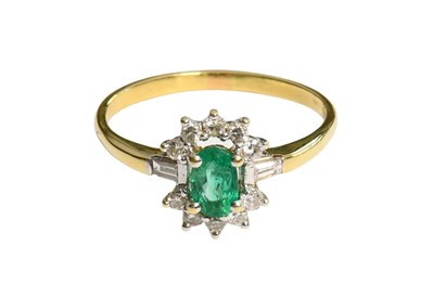 Lot 197 - An Emerald and Diamond Cluster Ring, the oval...