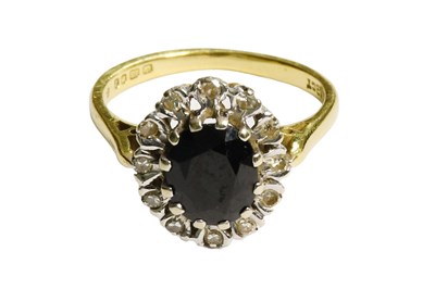 Lot 217 - An 18 Carat Gold Sapphire and Diamond Cluster...
