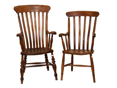 Lot 1215 - Two 20th Century Elm Comb Back Windsor Chairs