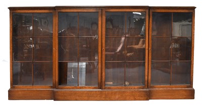 Lot 1256 - An Early 20th Century Oak Breakfront Bookcase,...