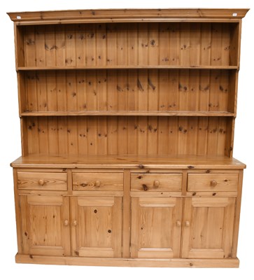 Lot 1267 - A 20th Century Pine Farmhouse Dresser and Rack,...