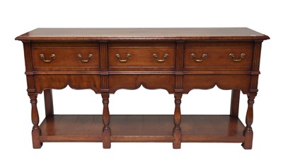 Lot 1483 - A 20th Century Three Drawer Sideboard, with...