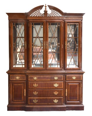 Lot 1474 - A 20th Century Mahogany Breakfront Bookcase...
