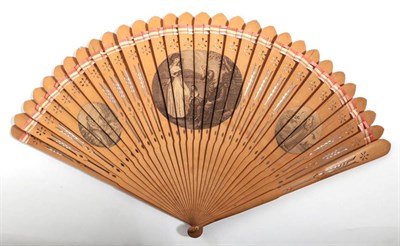 Lot 2013 - Circa 1790, A Pierced Wood Brisé Fan decorated with three engravings in shades of brown. The...