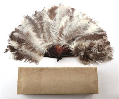 Lot 2058 - A Circa 1900 Female Ostrich Feather Fan, the feathers mottled in brown and soft cream, mounted...
