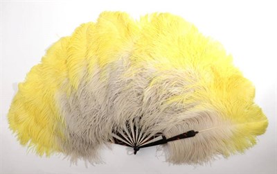 Lot 2062 - A Large and Extravagant 1920's Ostrich Feather Fan, unused, the tortoiseshell sticks still...
