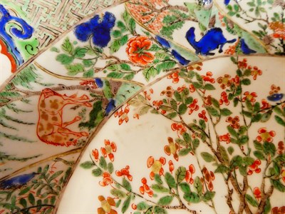 Lot 61 - A Chinese Porcelain Charger, Kangxi, painted in famille verte enamels with foliage within landscape