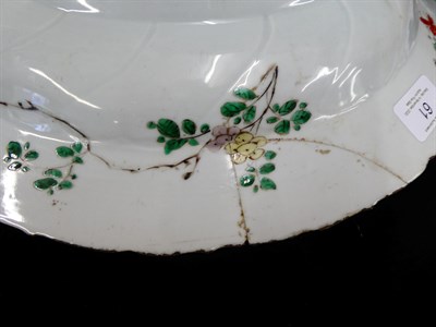 Lot 61 - A Chinese Porcelain Charger, Kangxi, painted in famille verte enamels with foliage within landscape