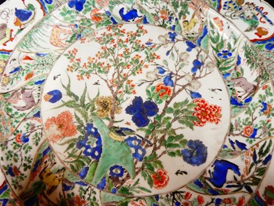 Lot 61 - A Chinese Porcelain Charger, Kangxi, painted in famille verte enamels with foliage within landscape