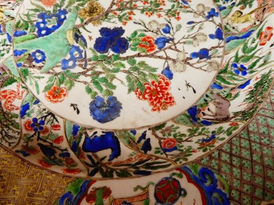 Lot 61 - A Chinese Porcelain Charger, Kangxi, painted in famille verte enamels with foliage within landscape